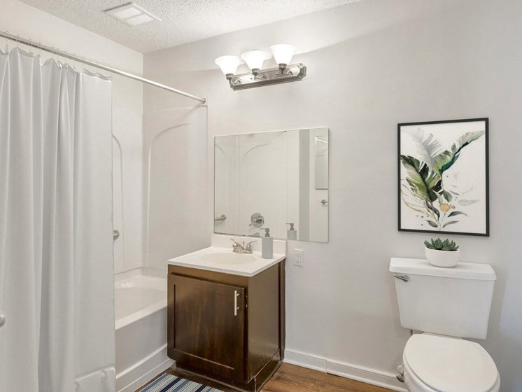 the preserve at ballantyne commons apartment bathroom with toilet sink and shower